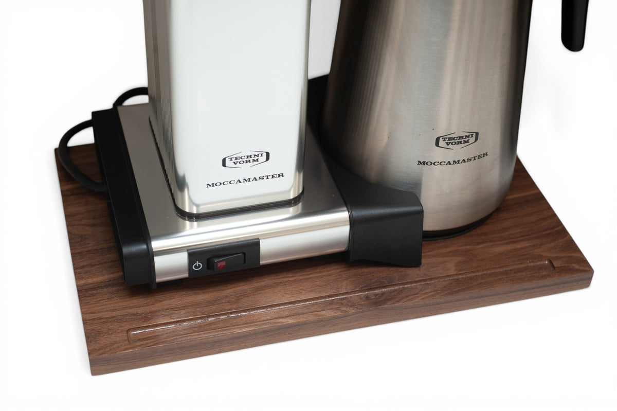 Moccamaster coffee maker sitting on the solid walnut rolling appliance stand